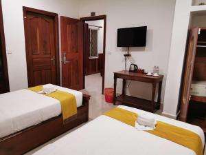 Postel nebo postele na pokoji v ubytování Hello Cambodia Boutique