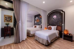 Voodi või voodid majutusasutuse Hanoi Center Silk Lullaby Hotel and Travel toas