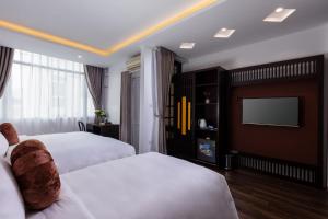 Voodi või voodid majutusasutuse Hanoi Center Silk Lullaby Hotel and Travel toas