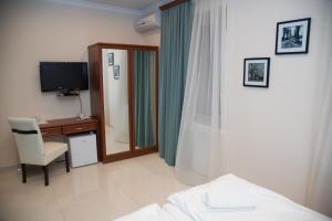 TV a/nebo společenská místnost v ubytování Mia Casa Hotel Yerevan