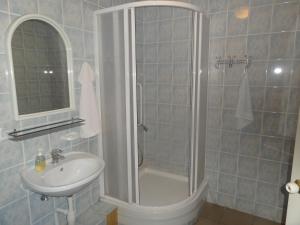 a bathroom with a shower and a sink at Sia Rebir D, Hotel Rebir in Daugavpils +45 photos