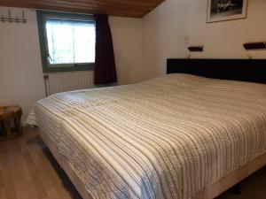 Postel nebo postele na pokoji v ubytování Vakantiebungalow Oase