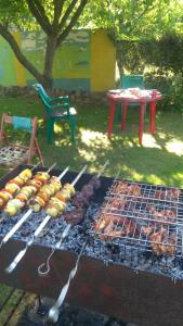 a grill with a bunch of food on it at Гостевой таунхаус in Demidov
