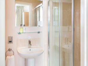 a bathroom with a sink and a shower at Bay Tree House in Bath