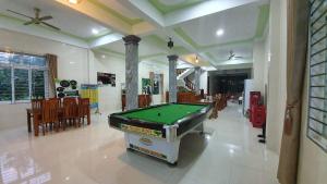 a hall with a pool table in a room at Phong Nha Amanda Homestay in Phong Nha
