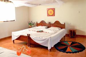 מיטה או מיטות בחדר ב-Secret Escape Nilaveli Ayurveda Hotel & Spa