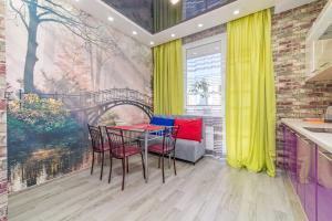 a dining room with a table and chairs in a kitchen at Apartments on the Black Sea in Odesa