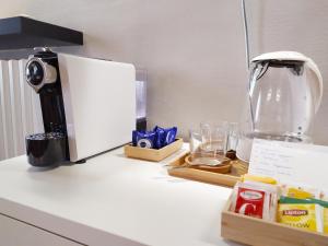 a kitchen counter with a coffee maker on top of it at Carducci 49 in Mantova
