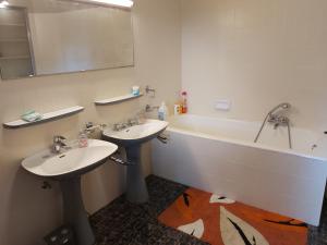 a bathroom with a sink, toilet and bathtub at Château Lambert Hotel-Resto-Parking-Shuttle, a 1 ha green Oasis at 8 min from CRL Airport without any noise in Charleroi
