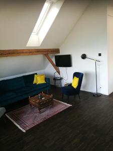 TV a/nebo společenská místnost v ubytování Ackaert Ferienwohnung Top of Thun
