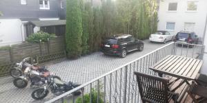 a couple of motorcycles parked in a parking lot at Eleonora Apartment in Winterberg