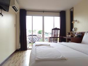 Baan Wanchart客房内的一张或多张床位
