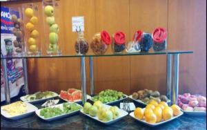 a display of fruits and vegetables on a counter at Hotel Alfonso IX in Sarria