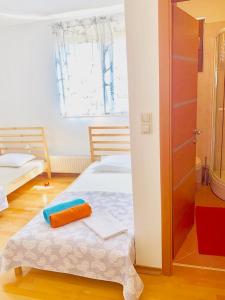 Posteľ alebo postele v izbe v ubytovaní Vila Ružica