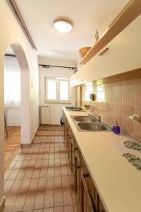 Η κουζίνα ή μικρή κουζίνα στο Apartman Zen +2 φωτογραφίες
