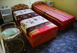 Кровать или кровати в номере Tiszafa Vendégház Nagykanizsa