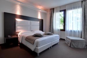 Postel nebo postele na pokoji v ubytování Hotel Villa Pannonia + 37 fotografií