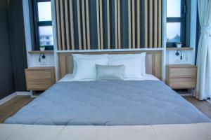 Uma cama ou camas num quarto em Apartments Stanaj