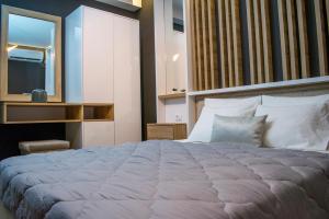 Uma cama ou camas num quarto em Apartments Stanaj