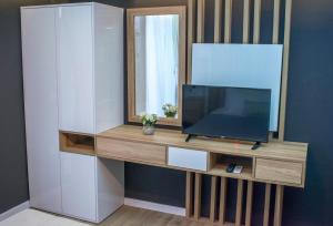 TV i/ili multimedijalni sistem u objektu Apartments Stanaj