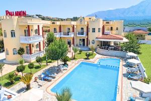 uma imagem de uma villa com piscina em Palladion Hotel em Georgioupolis