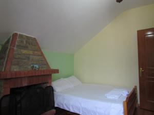 Postel nebo postele na pokoji v ubytování Hotel Germenji