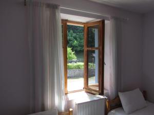 Postel nebo postele na pokoji v ubytování Hotel Germenji