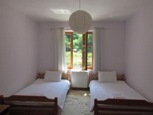 Postel nebo postele na pokoji v ubytování Hotel Germenji