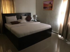 Voodi või voodid majutusasutuse Choice Suites II toas