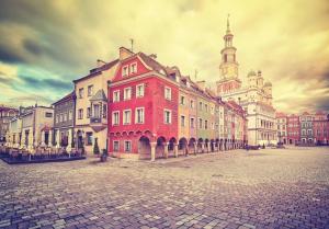 a group of buildings on a street in a city at Stary Rynek Old Market Apartments in Poznań