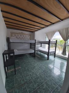 Postel nebo postele na pokoji v ubytování Emotion Avenida Tulum Hotel & Hostal