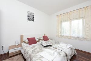 Postel nebo postele na pokoji v ubytování Apartmani Damant