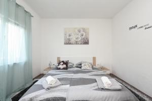 Postel nebo postele na pokoji v ubytování Apartmani Damant