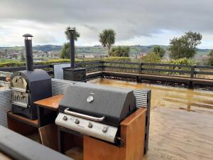 a grill and smoker on top of a patio at The Reservation B&B in Gore