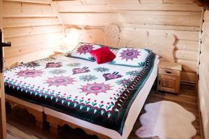 Postel nebo postele na pokoji v ubytování Domek Regionalny