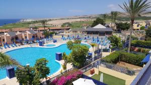 an aerial view of a swimming pool at a resort at Best Views Meloneras Deluxe 113 in San Bartolomé de Tirajana