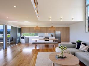 a living room with a couch and a table at Absolute Waterfront in Gerroa