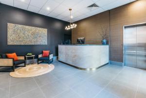 a lobby of a hotel with a reception desk at Gabba Central Apartments in Brisbane