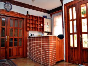 a kitchen with wooden cabinets and a brick counter top at Frankfurt Hotel in Antalya