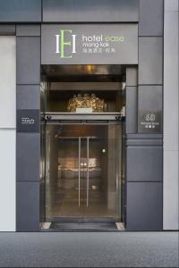an entrance to a hotel case in a building at Hotel Ease Mong Kok in Hong Kong