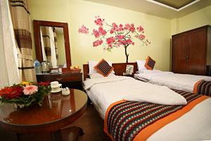 Voodi või voodid majutusasutuse Hotel Osho Home toas