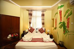 Voodi või voodid majutusasutuse Hotel Osho Home toas