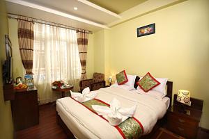 Voodi või voodid majutusasutuse Hotel Osho Home toas