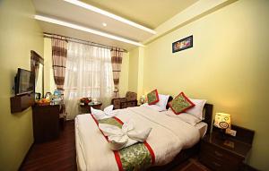 Voodi või voodid majutusasutuse Hotel Osho Home toas