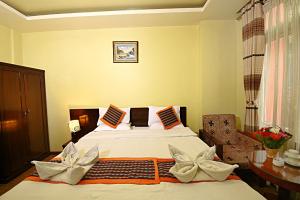 Voodi või voodid majutusasutuse Hotel Osho Home toas