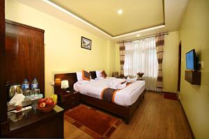 Voodi või voodid majutusasutuse Hotel Osho Home toas