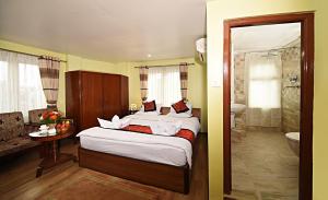 Voodi või voodid majutusasutuse Hotel Osho Home toas