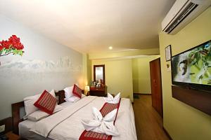 Voodi või voodid majutusasutuse Hotel Osho Home toas