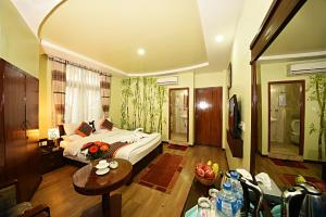 Voodi või voodid majutusasutuse Hotel Osho Home toas