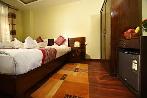 Voodi või voodid majutusasutuse Hotel Osho Home toas